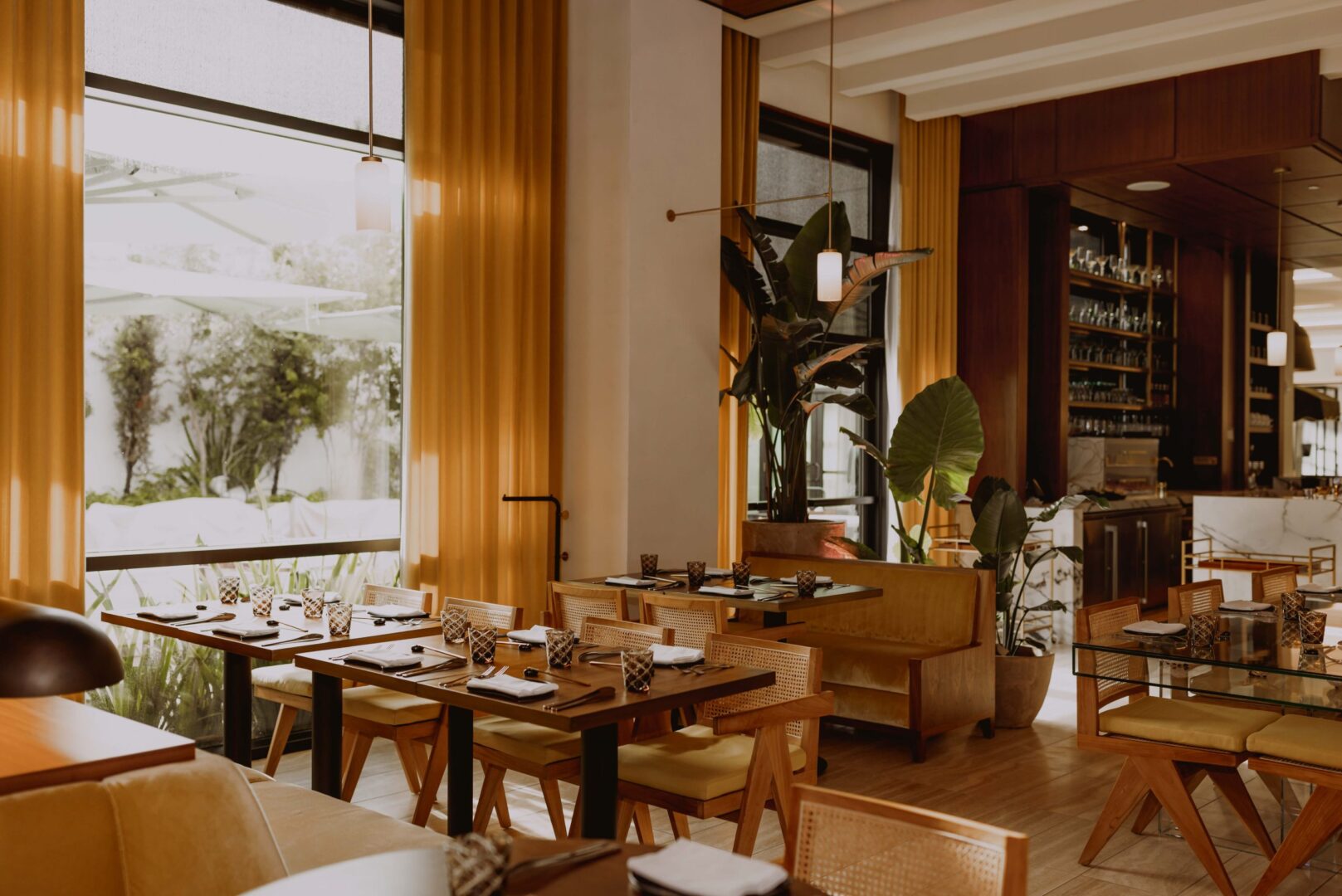 A restaurant with tables and chairs.