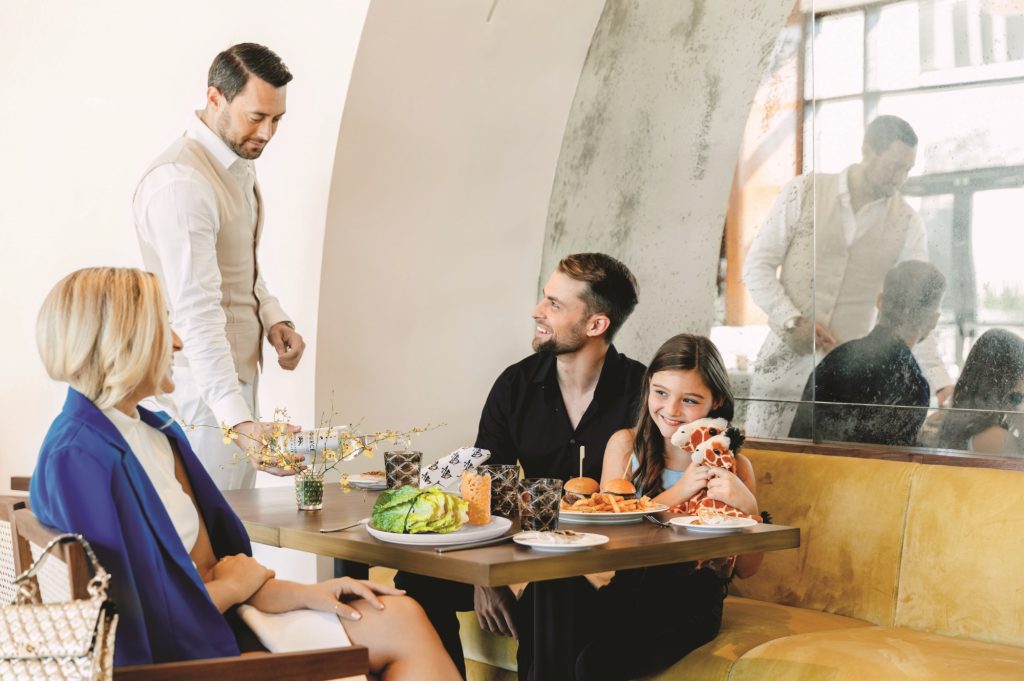 A man enjoying food with his family