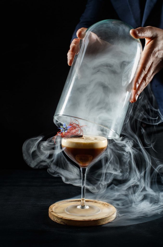 A person pouring a liquid into a glass.