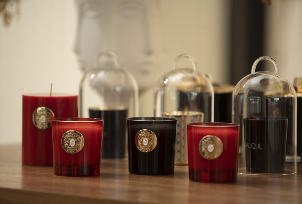 A table with candles and jars on it