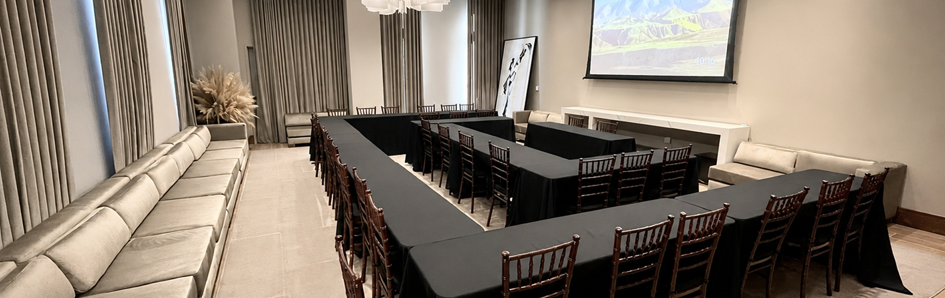 Meeting room set with a long dark conference table